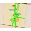 Confezione bomboniera con decorazione floreale verde