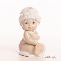 Bomboniere Morena: Bimba neonata seduta con Cuffietta